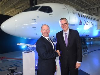 Alain Bellemare, left, president and CEO of Bombardier Inc., and Ed Bastian, right, CEO of Delta Air Lines, shake hands in front of a Delta-branded Bombardier C-Series jet in Mirabel, Que., on Thursday, April 28, 2016. Bombardier received a major boost Thursday from Delta Air Lines, which has placed a firm order for 75 CS100 aircraft with options for an additional 50 more in what would be the largest order for the Montreal company's troubled CSeries passenger jet program. THE CANADIAN PRESS/Ryan Remiorz