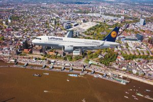 Lufthansa is now flying the A320neo, pictured here over the city of Hamburg, in a normal airline schedule, but only to selected destinations. Credit: Lufthansa